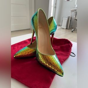 Worn once, resoled iridescent Louboutin Heels. Comes in Iconic red dust bag.